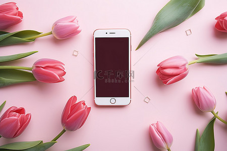 平板放在桌子上背景图片_粉色郁金香智能手机放在桌子上，周围是一些花