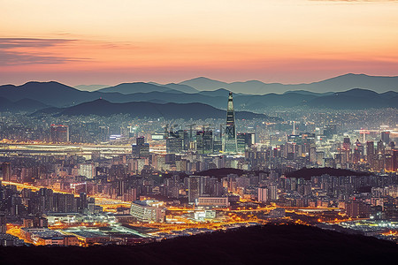 城市和背景图片_首尔天际线黄昏时的城市和山脉图片