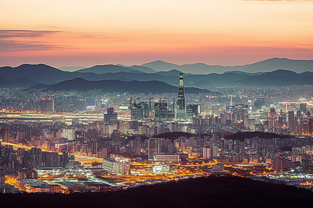 南山松背景图片_首尔天际线黄昏时的城市和山脉图片