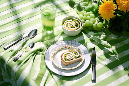 野餐桌背景图片_一张野餐桌，上面有各种各样的蔬菜盘子叉子和刀