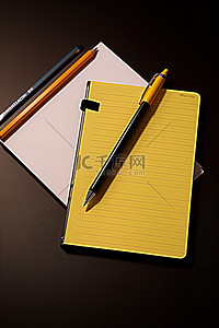 原创手写体背景图片_带有爱普生手写笔和铅笔的记事本