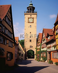 古老的小镇背景图片_德国一座古老小镇的街道上矗立着一座钟楼
