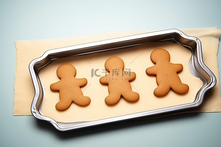 烤饼背景图片_带有 4 个刀具的烤盘，用于制作姜饼