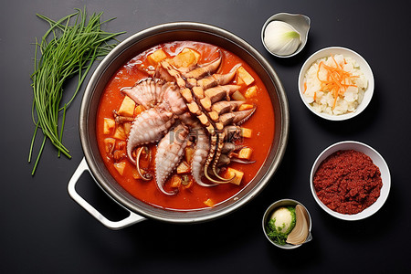插画火锅配菜背景图片_韩国传统美食美味的章鱼炖菜及其配菜