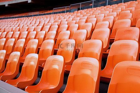 体育场内背景图片_体育场内有空白座位的橙色座位