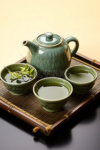 黑茶壶背景图片_黑托盘上的绿茶壶和杯子