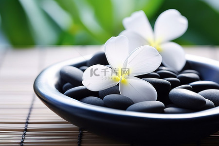 坐在石头背景图片_黑色的石头和一朵花坐在碗里