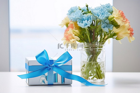 一束鲜花与蓝丝带和礼品盒