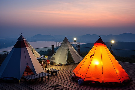 甲板背景图片_在室外甲板顶部的三个帐篷欣赏日落