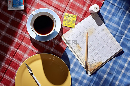 蓝色格子布桌布有咖啡碗和茶壶