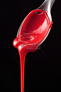容器液体背景图片_红色液体从瓶子里倒到勺子上