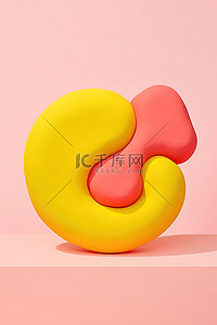 粘土背景图片_黄色表面上由粉色和黄色粘土粉制成的球体