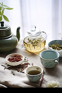 绿茶茶叶背景图片_桌子上有一些绿茶和茶壶