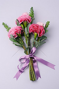 粉色康乃馨背景图片_三朵粉色康乃馨，绿叶和丝带