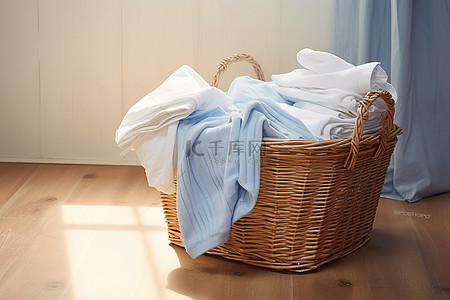 地板上放有床单的洗衣篮 地板上放着衣物和衣夹