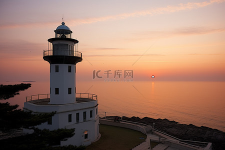 南海观音背景图片_韩国南海公园灯塔日出