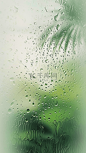 春天绿色玻璃窗上的雨点素材