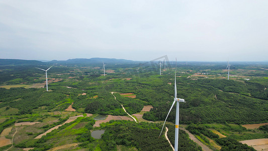 航拍山顶新能源风力发电风轮机