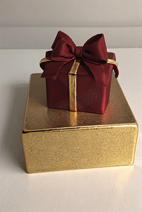 礼物盒精致摄影照片_精致的金色礼物盒摄影图1