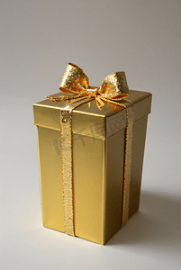 礼物盒精致摄影照片_精致的金色礼物盒摄影图10