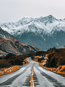 自驾道路摄影照片_雪山下的公路新西兰自驾风光