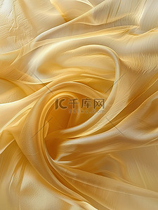 流动的淡黄色缎带背景图片