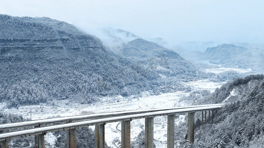 航拍云贵高原桥梁大雪景色