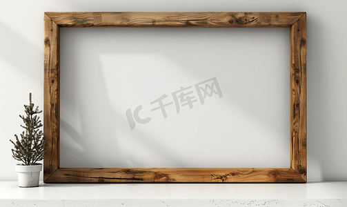 木制画框摄影照片_白色墙壁上的木制画框