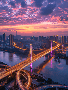 晚霞下摄影照片_夕阳晚霞下的武汉鹦鹉洲大桥夜景