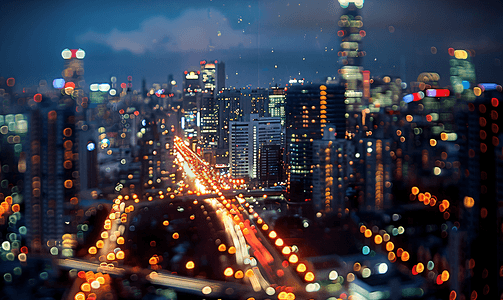 灯光下的城市夜景摄影照片_夜晚下全景俯瞰城市