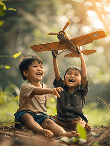 开飞机摄影照片_亚洲人两个男孩玩开飞机游戏