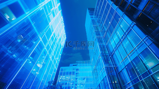 现代建筑高楼背景图片_蓝色灯光夜晚仰视城市高楼大厦的背景