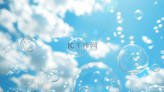 小蓝色梦幻背景图片_蓝色夏季蓝天中漂浮的气泡背景