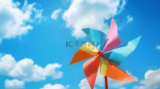 旋转的背景图片_六一儿童节蓝天白云里的卡通纸风车背景