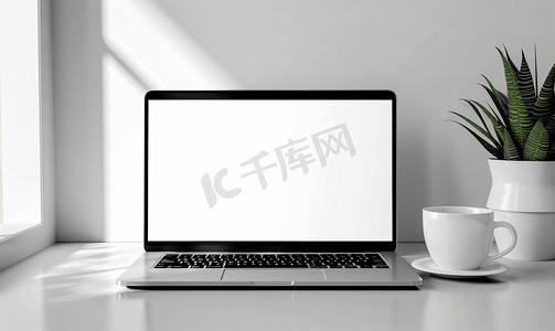 灯光室内背景摄影照片_有白色空白屏幕和桌上白咖啡的笔记本电脑