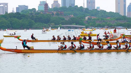 喜庆节日促销海报摄影照片_实拍端午节传统节日活动赛龙舟模板