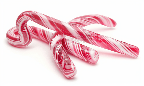 圣诞白色背景摄影照片_白色背景中的两根拐杖糖传统的圣诞糖果