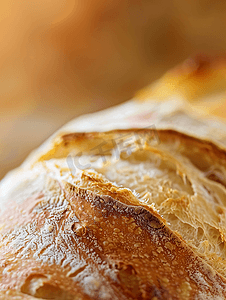面包蛋糕烘培店摄影照片_自制面包表面美丽的面包皮特写