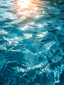 太阳图案摄影照片_蓝色泳池水面与太阳反射的水背景