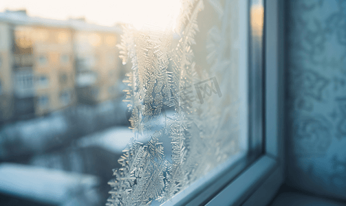 冬天窗户背景摄影照片_城市房屋窗户表面结霜