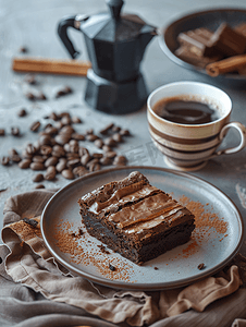 美食蛋糕摄影照片_装有一片布朗尼的盘子、咖啡机和一杯咖啡