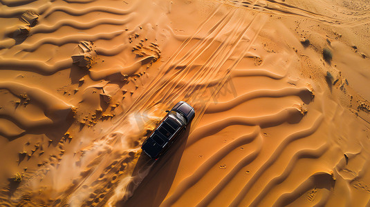 沙漠蜜瓜摄影照片_沙漠汽车行驶俯瞰摄影照片