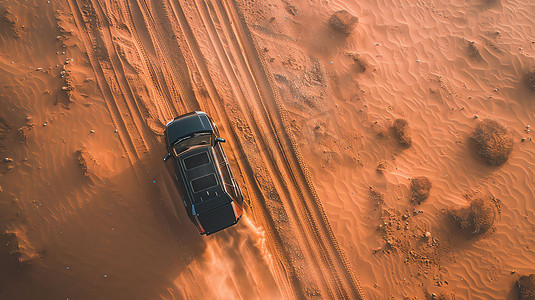 俯瞰沙漠摄影照片_沙漠汽车行驶俯瞰摄影照片