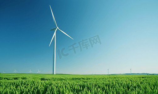 绿色动能摄影照片_田野上的风力涡轮机