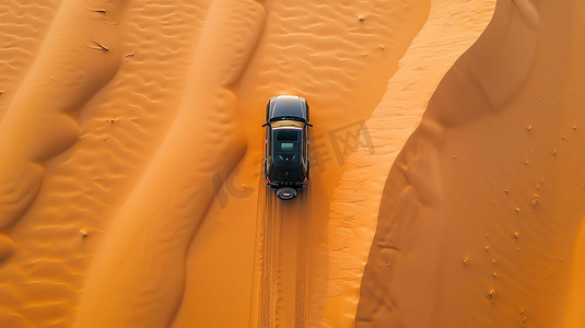 汽车沙漠摄影照片_沙漠汽车行驶俯瞰摄影照片