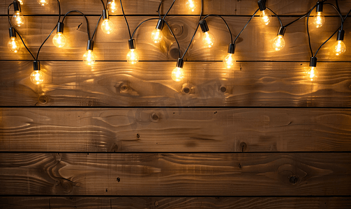 半岛背景摄影照片_深色木材中的灯泡由花环发光背景制成