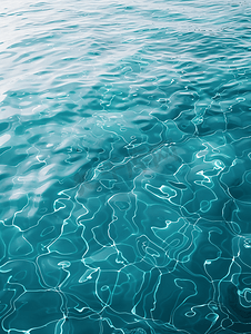 清澈蓝色水摄影照片_海水或海洋水背景水面