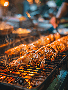 热腾腾摄影照片_在聚会上在热腾腾的海鲜烧烤架上享用大虾