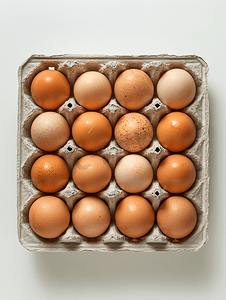 剪鸡蛋摄影照片_隔离盒中十个鸡蛋的顶视图