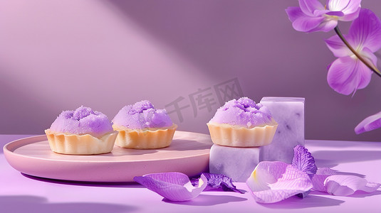 蛋挞点心紫色花瓣摄影图
